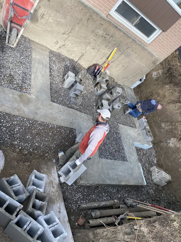 First course of block being laid on a new footing in Toronto