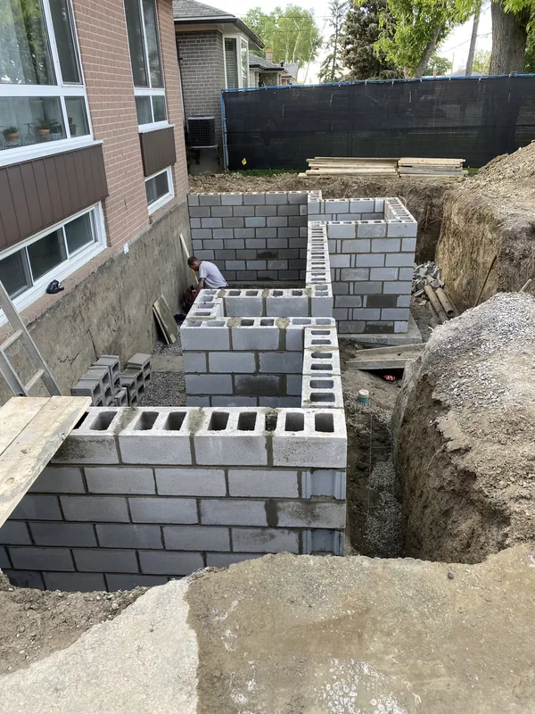 New concrete block foundation walls for a walkout on a Toronto home