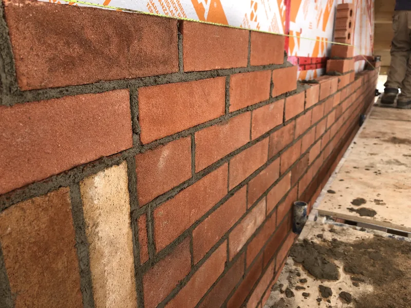 New red brick tied into a buff brick corner quoin near Enniskillen in Clarington