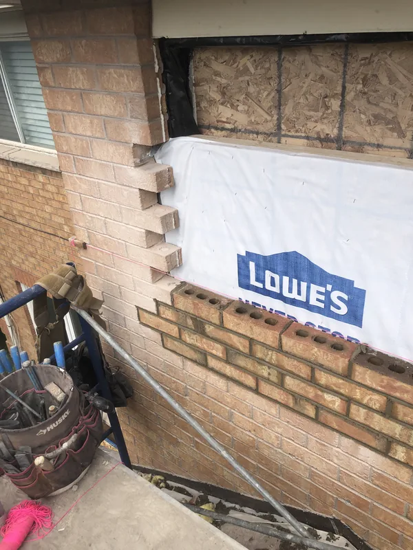Brick infill toothed in around a window opening on a Whitby home