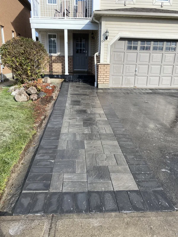 Paver front walkway with a dark border in Whitby