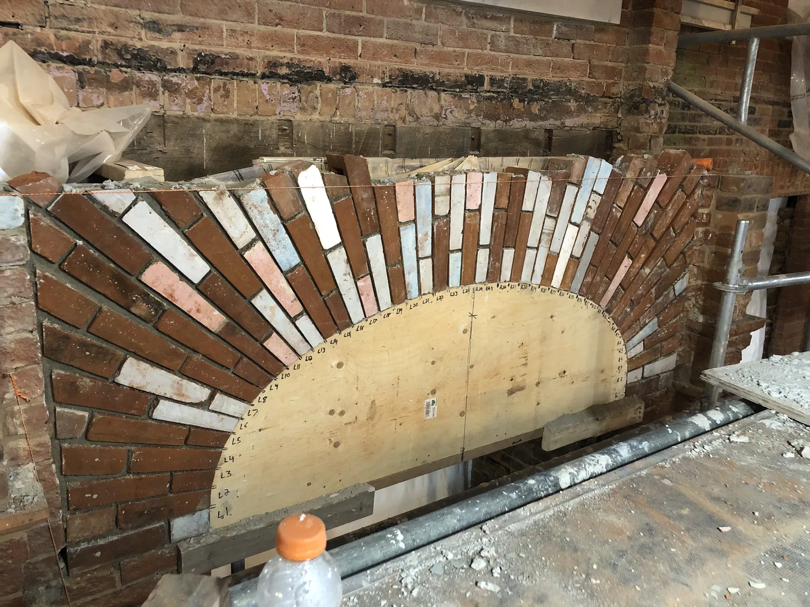 Brick arch rebuilt over a wooden form in a historic Toronto building