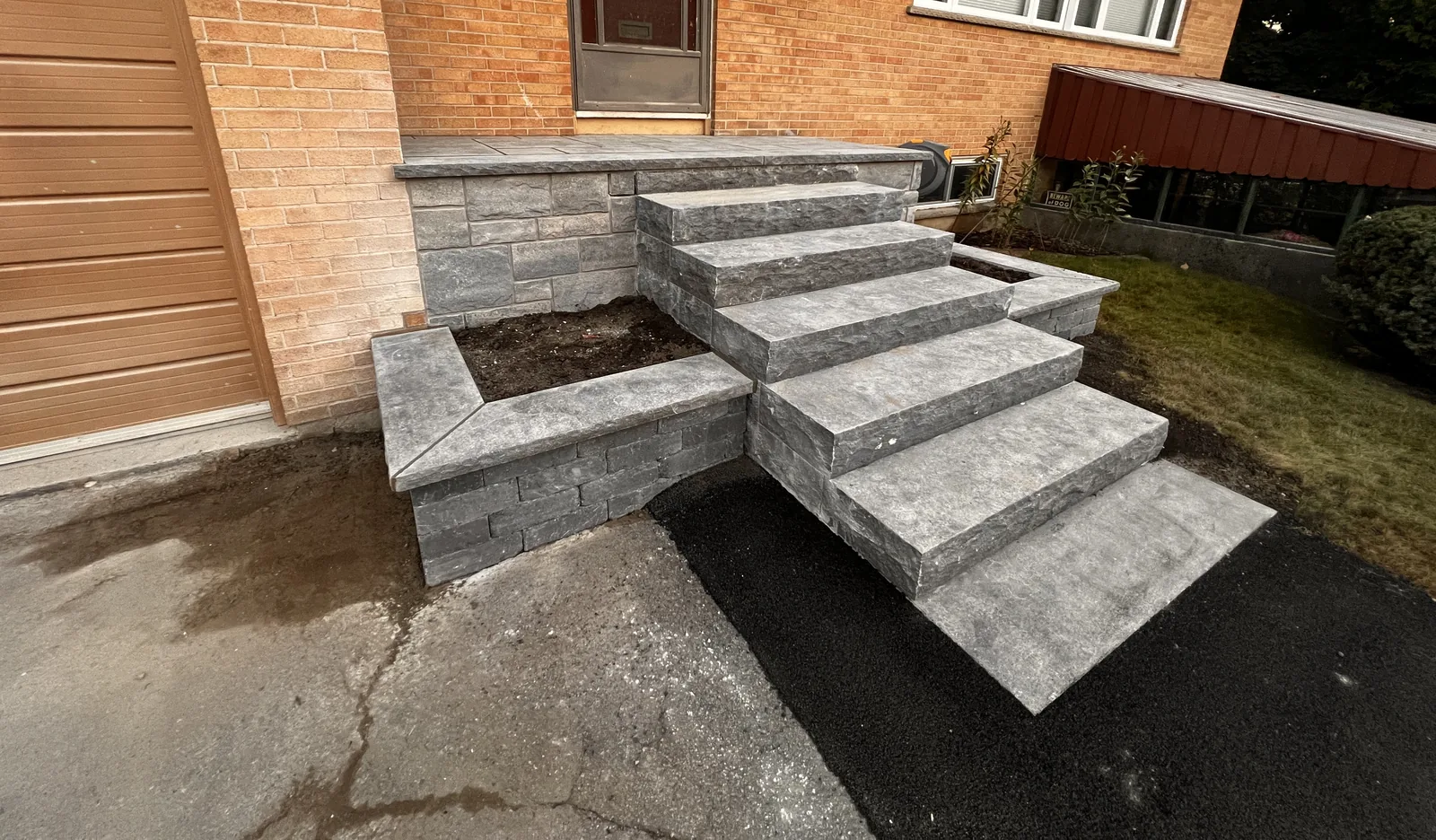 Rebuilt stone front steps on an Oshawa brick home