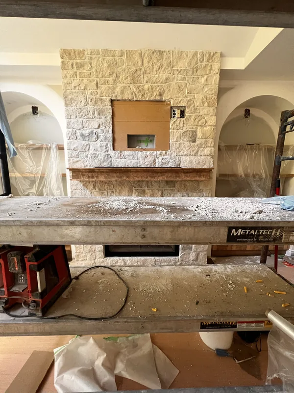 Natural stone fireplace wall built by Strongback in nearby Courtice