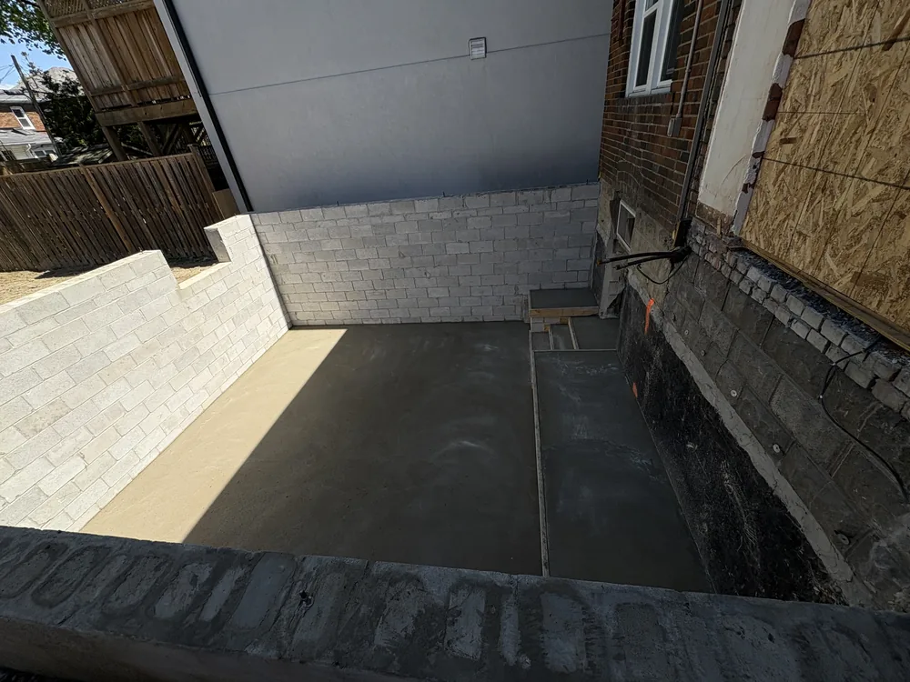 New block foundation walls and poured concrete slab for a home addition